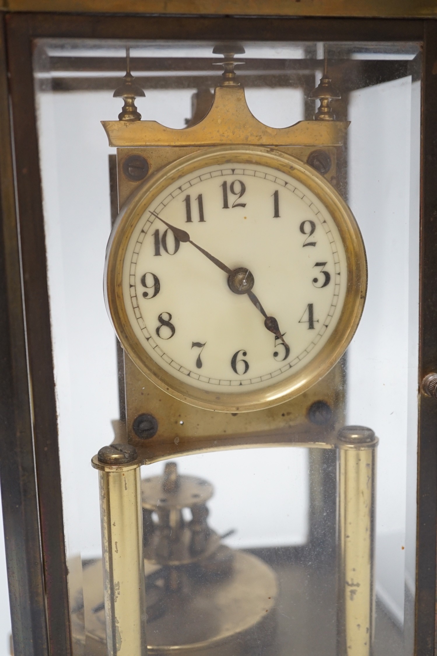 A brass four glass Anniversary clock, 29cms high